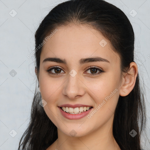 Joyful white young-adult female with long  brown hair and brown eyes