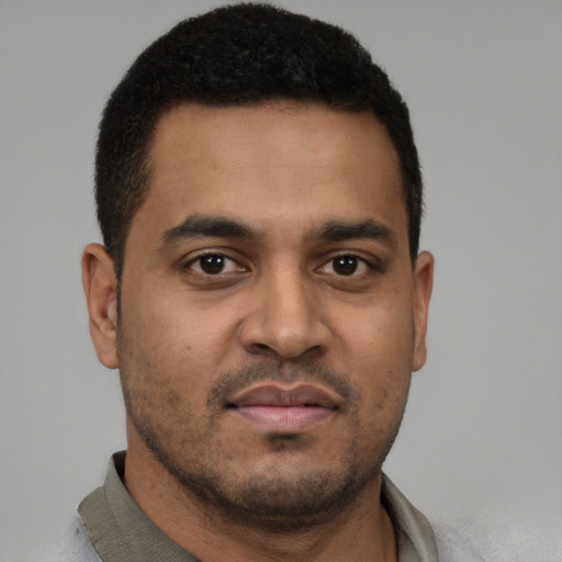 Neutral black young-adult male with short  brown hair and brown eyes