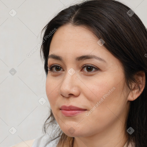 Joyful white adult female with medium  brown hair and brown eyes