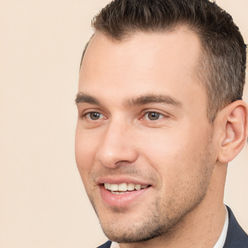 Joyful white young-adult male with short  brown hair and brown eyes