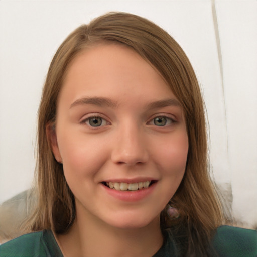 Joyful white child female with long  brown hair and green eyes