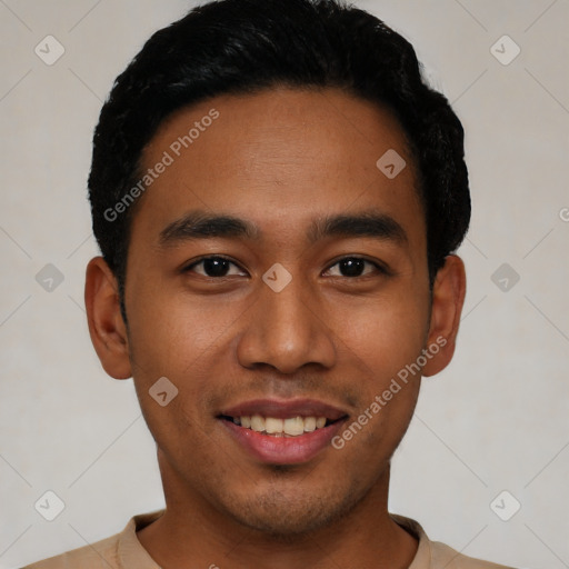 Joyful latino young-adult male with short  black hair and brown eyes