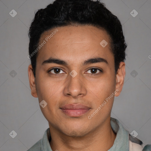 Joyful latino young-adult male with short  black hair and brown eyes