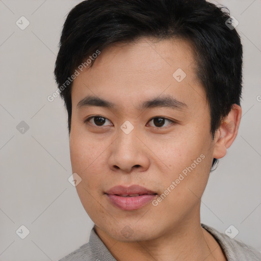 Neutral asian young-adult male with short  black hair and brown eyes