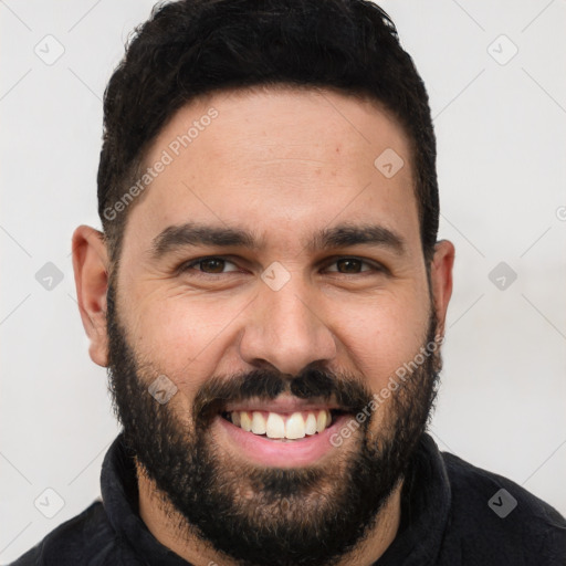 Joyful white young-adult male with short  black hair and brown eyes