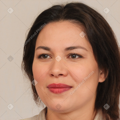 Joyful white adult female with medium  brown hair and brown eyes