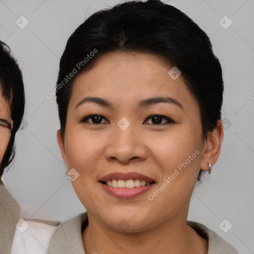 Joyful asian young-adult female with medium  brown hair and brown eyes