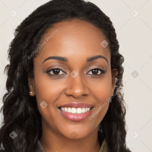 Joyful black young-adult female with long  brown hair and brown eyes