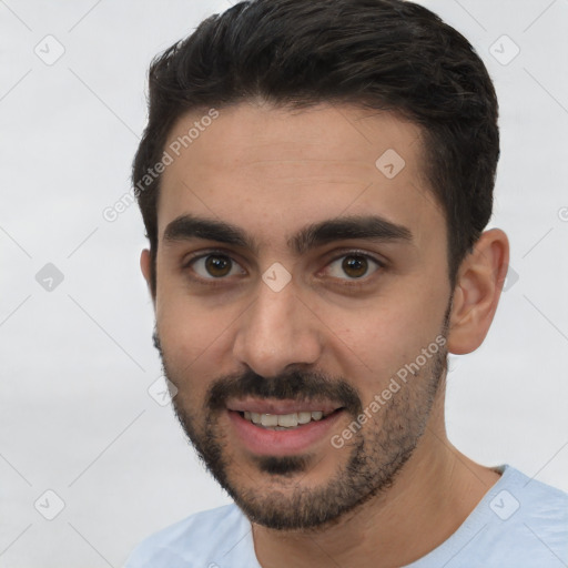 Joyful white young-adult male with short  brown hair and brown eyes