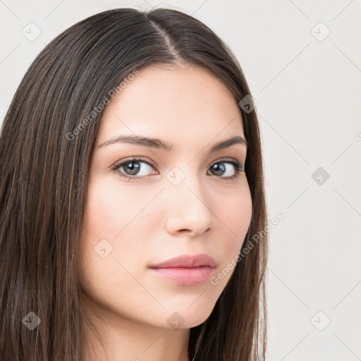 Neutral white young-adult female with long  brown hair and brown eyes