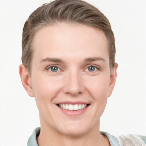 Joyful white young-adult female with short  brown hair and grey eyes