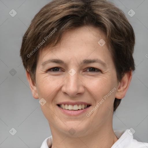 Joyful white adult female with short  brown hair and brown eyes