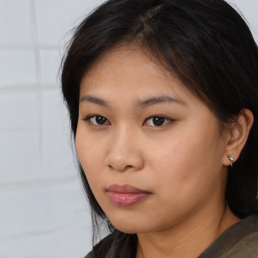 Neutral asian young-adult female with medium  brown hair and brown eyes