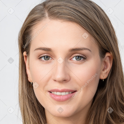 Joyful white young-adult female with long  brown hair and grey eyes