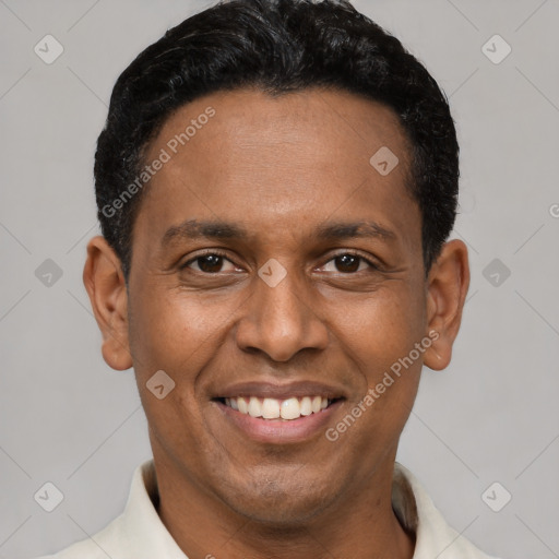 Joyful latino young-adult male with short  black hair and brown eyes
