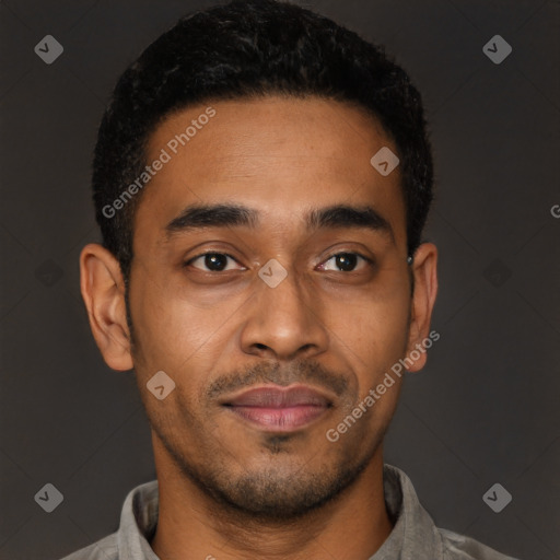 Joyful latino young-adult male with short  brown hair and brown eyes