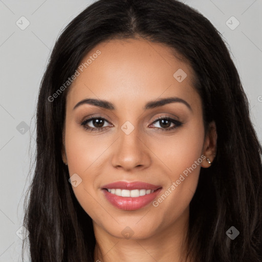 Joyful latino young-adult female with long  brown hair and brown eyes