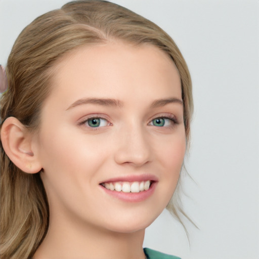 Joyful white young-adult female with long  brown hair and blue eyes