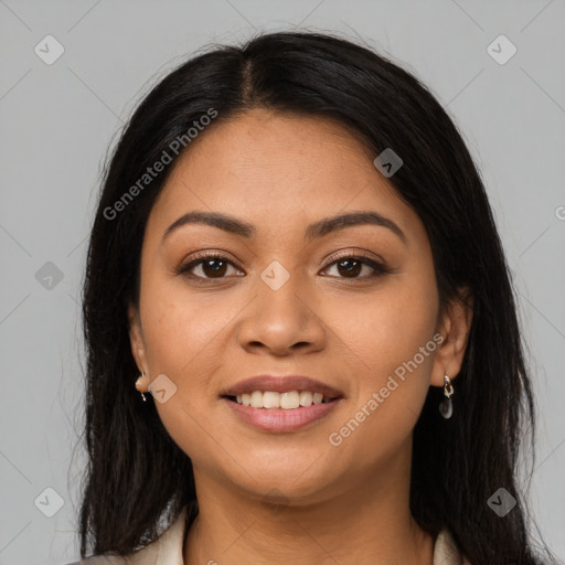 Joyful latino young-adult female with long  brown hair and brown eyes