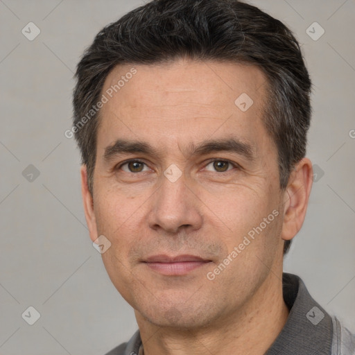 Joyful white adult male with short  brown hair and brown eyes