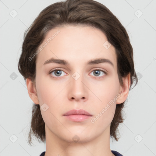 Neutral white young-adult female with short  brown hair and brown eyes