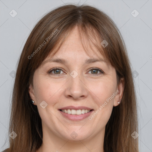 Joyful white adult female with long  brown hair and grey eyes