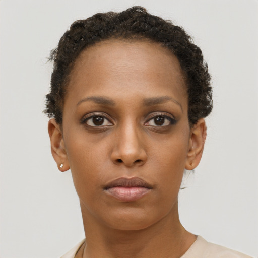 Neutral black young-adult female with short  brown hair and brown eyes