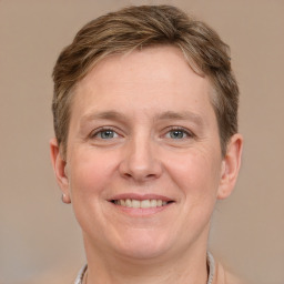 Joyful white adult female with short  brown hair and grey eyes