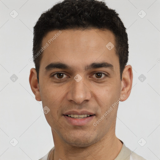 Joyful white young-adult male with short  black hair and brown eyes
