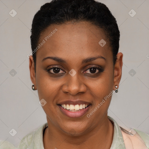 Joyful black young-adult female with short  black hair and brown eyes