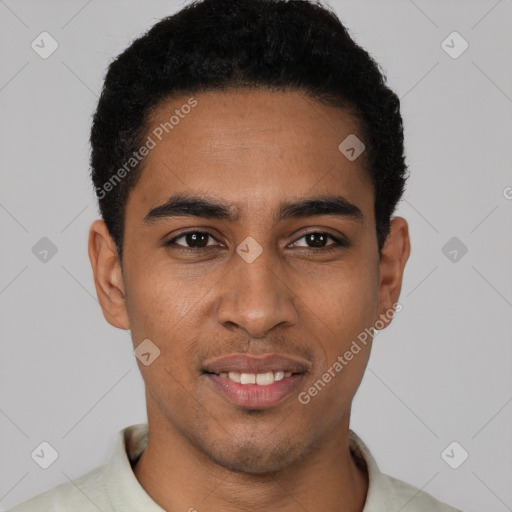 Joyful latino young-adult male with short  black hair and brown eyes