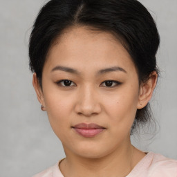 Joyful asian young-adult female with medium  brown hair and brown eyes