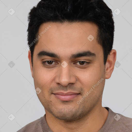 Joyful latino young-adult male with short  black hair and brown eyes