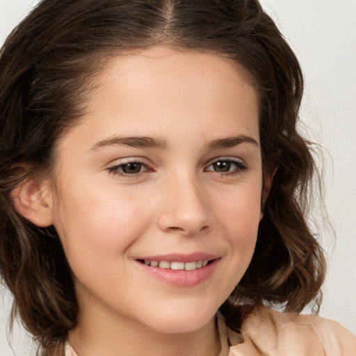 Joyful white child female with long  brown hair and brown eyes