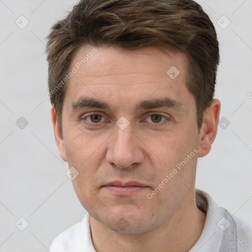 Joyful white adult male with short  brown hair and brown eyes