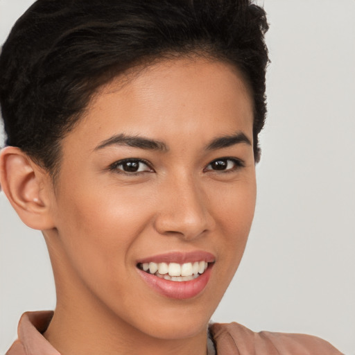 Joyful latino young-adult female with short  brown hair and brown eyes