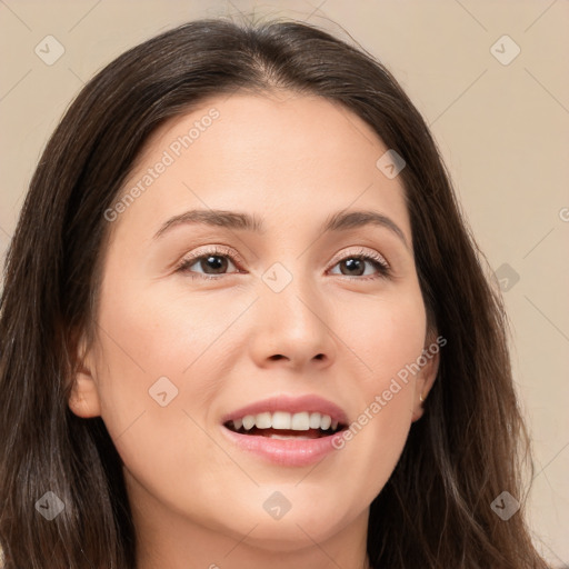 Joyful white young-adult female with long  brown hair and brown eyes