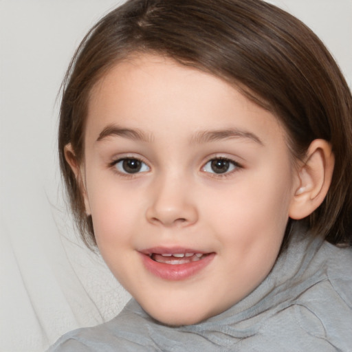 Joyful white child female with medium  brown hair and brown eyes