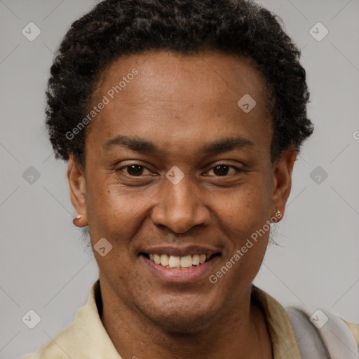 Joyful latino adult male with short  brown hair and brown eyes