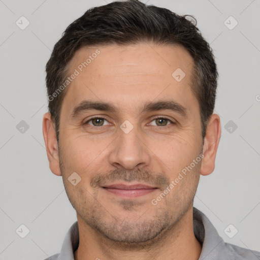 Joyful white adult male with short  brown hair and brown eyes