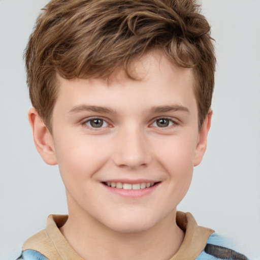 Joyful white child male with short  brown hair and grey eyes