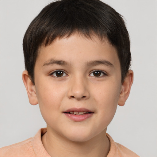 Joyful white child male with short  brown hair and brown eyes