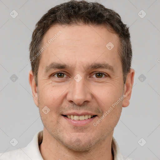 Joyful white adult male with short  brown hair and brown eyes