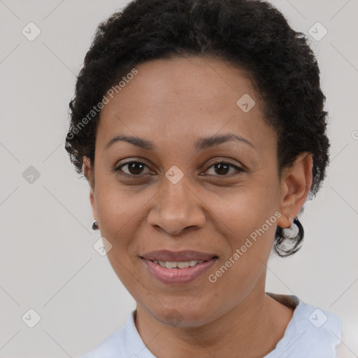 Joyful latino adult female with short  brown hair and brown eyes