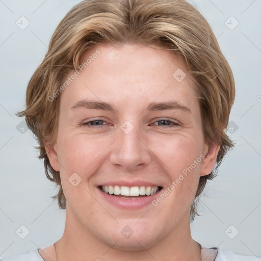 Joyful white young-adult female with medium  brown hair and blue eyes