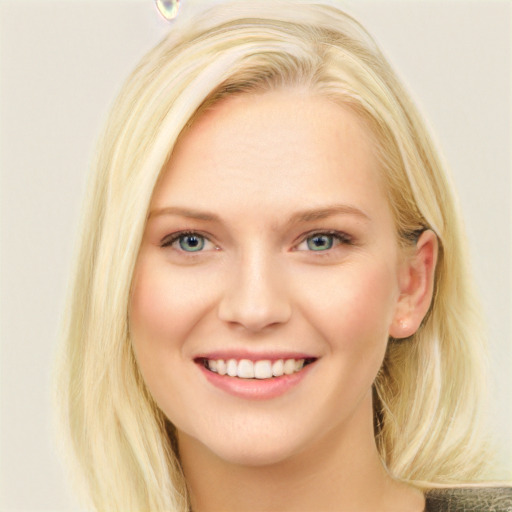 Joyful white young-adult female with long  brown hair and blue eyes