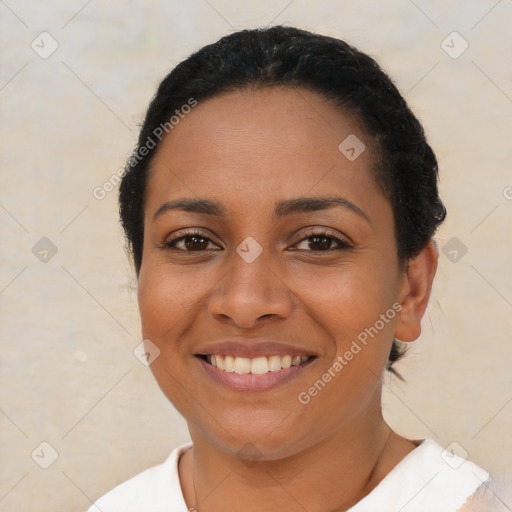 Joyful latino young-adult female with short  brown hair and brown eyes