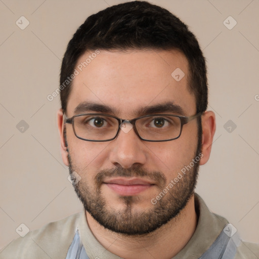 Joyful white young-adult male with short  black hair and brown eyes