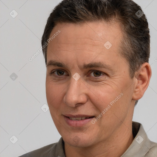 Joyful white adult male with short  brown hair and brown eyes