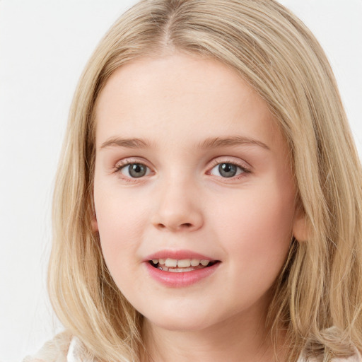 Joyful white child female with long  brown hair and blue eyes